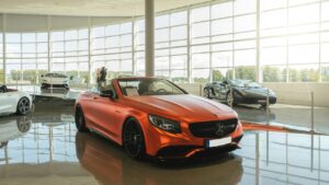 red chevrolet camaro parked in front of building